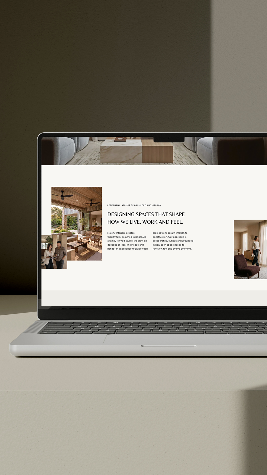 An image of a laptop with an interior design website template on the screen
